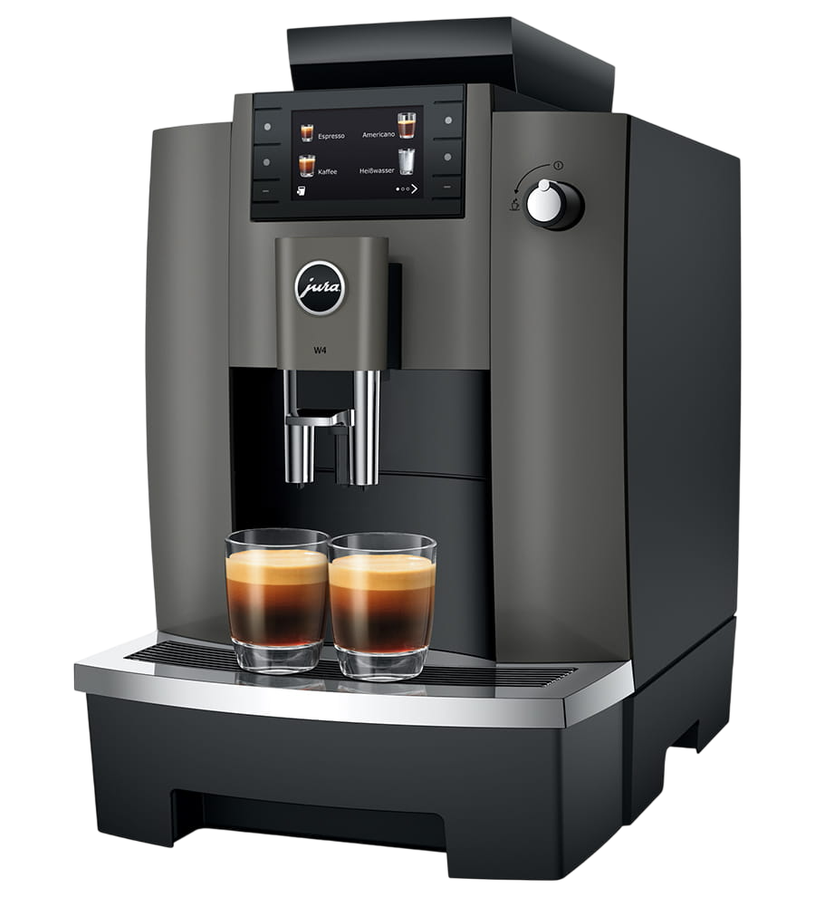 Eine dunkelgraue Jura W4 Kaffeemaschine mit zwei Gläsern Espresso davor.