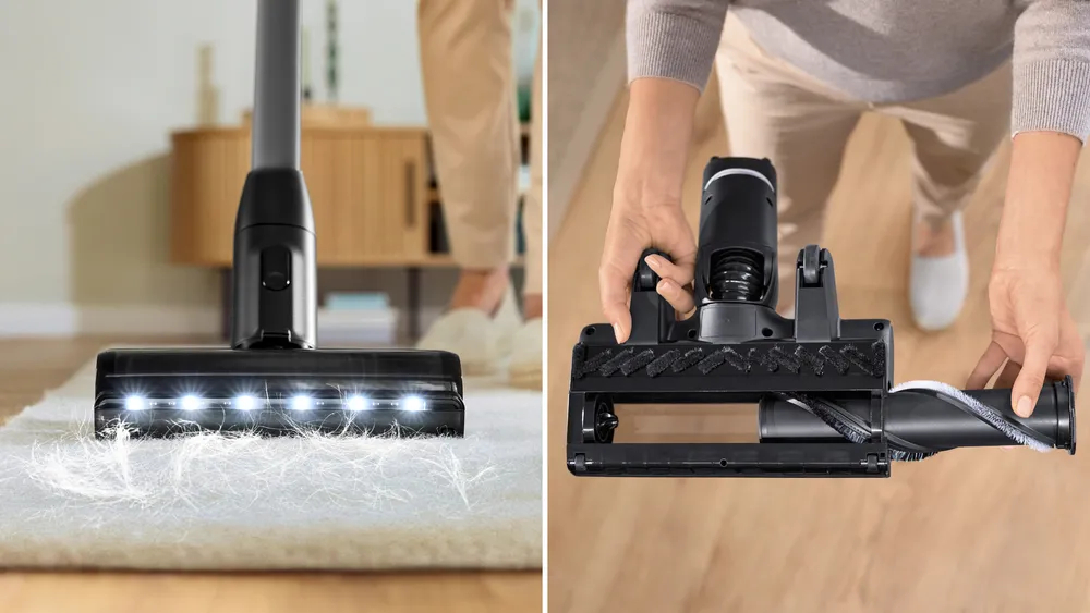 Głowica odkurzacza na dywanie. Światła włączone. Odkręcona głowica odkurzacza i osoba w tle.