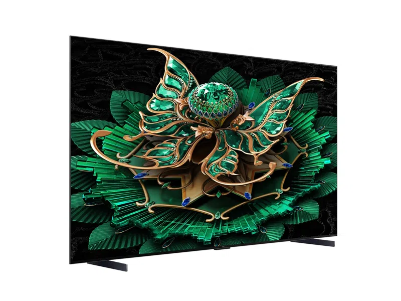 Ein Fernsehbildschirm, der ein grünes und goldenes Blumenmuster mit schwarzem Hintergrund zeigt.
