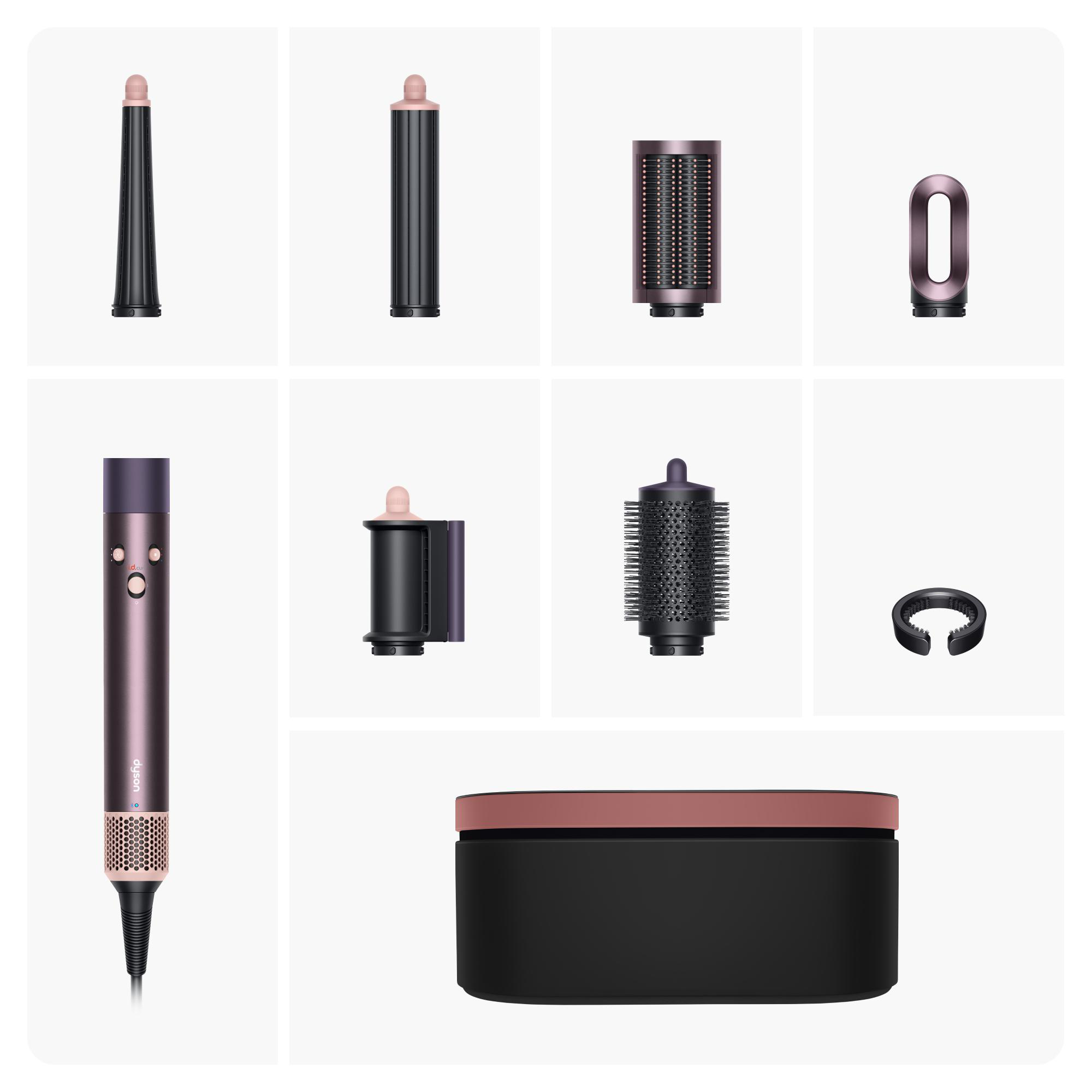 Verschiedene Aufsätze für ein Dyson-Haarstyling-Tool werden auf einer weißen Oberfläche angezeigt.