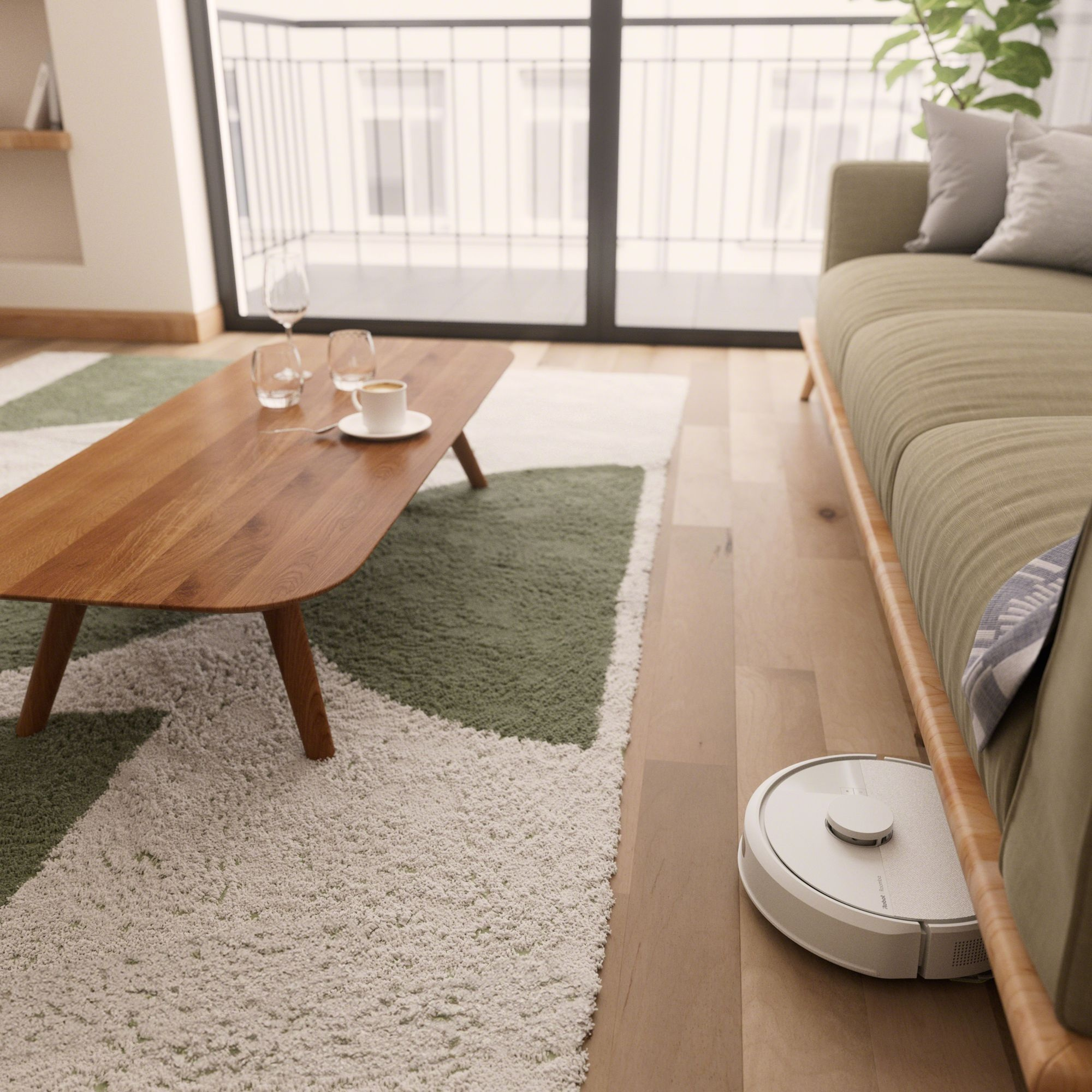 Odkurzacz automatyczny pod sofą w pokoju.