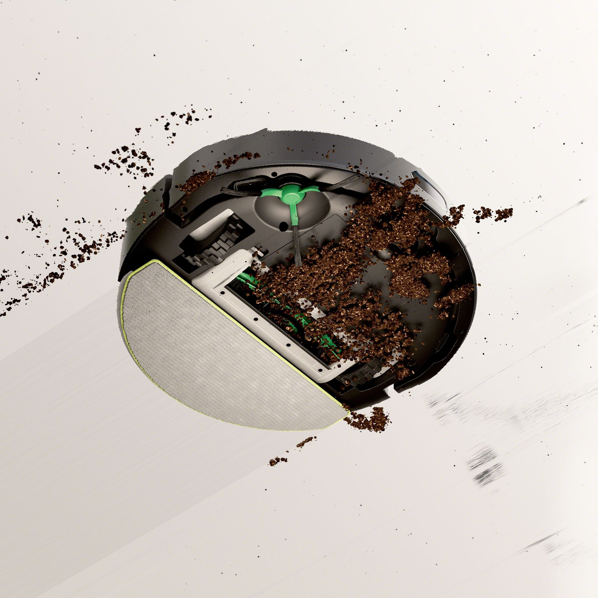 Odkurzacz robot, pokryty brudem, jest pokazany pochylony na białym tle.