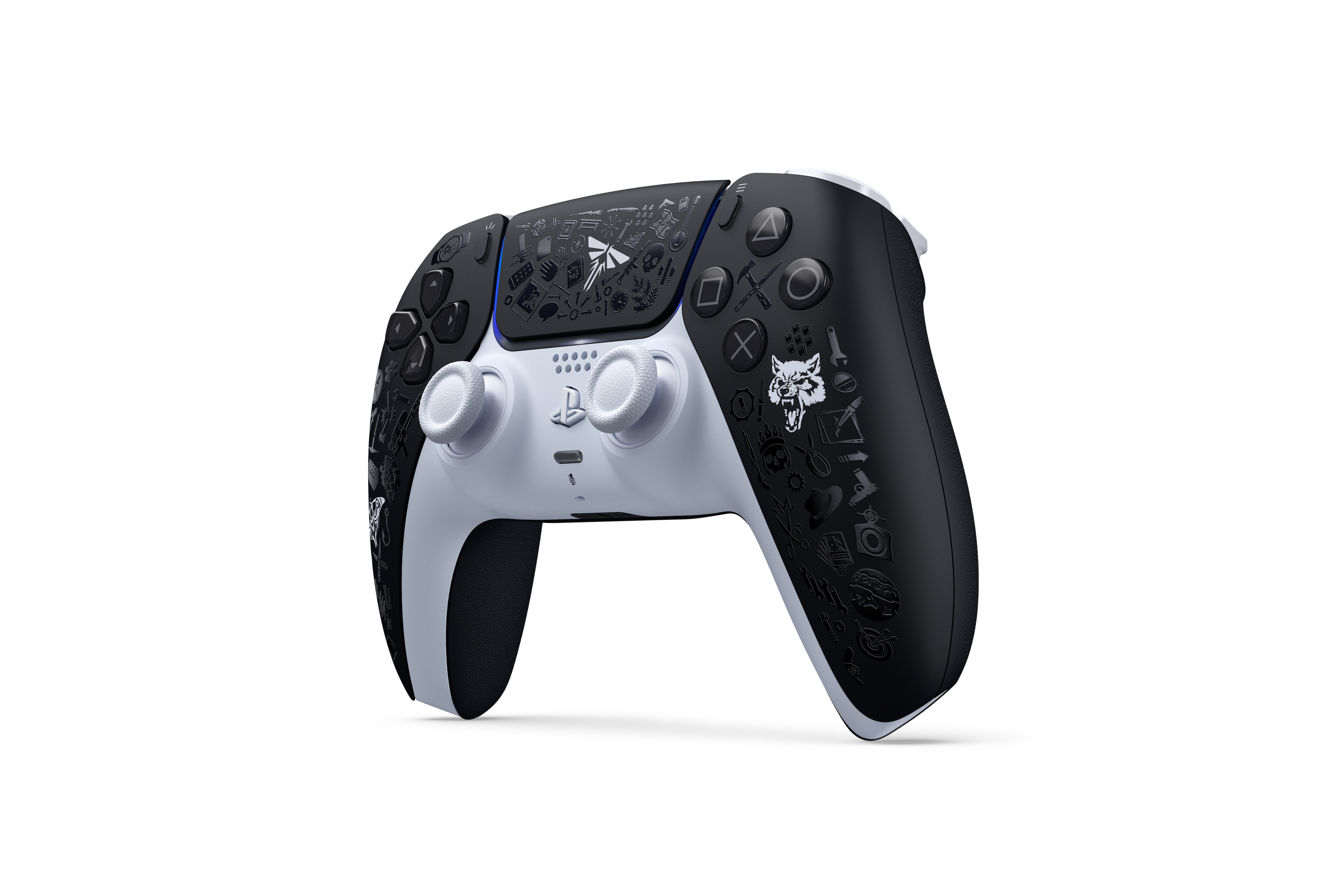 Schwarz-weißer Playstation-Controller mit Spielmotiven.