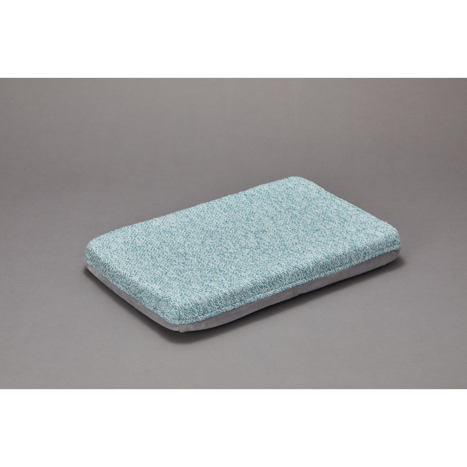 Blue and white pet bed on a gray surface, angled view.