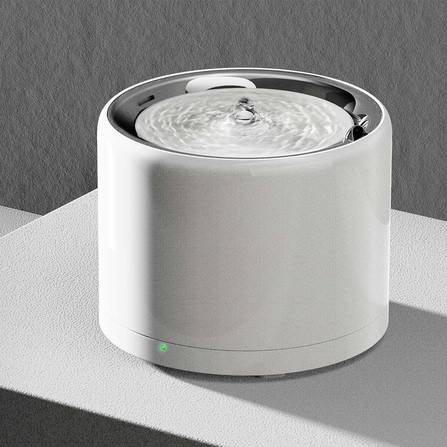 White, cylindrical pet water fountain.