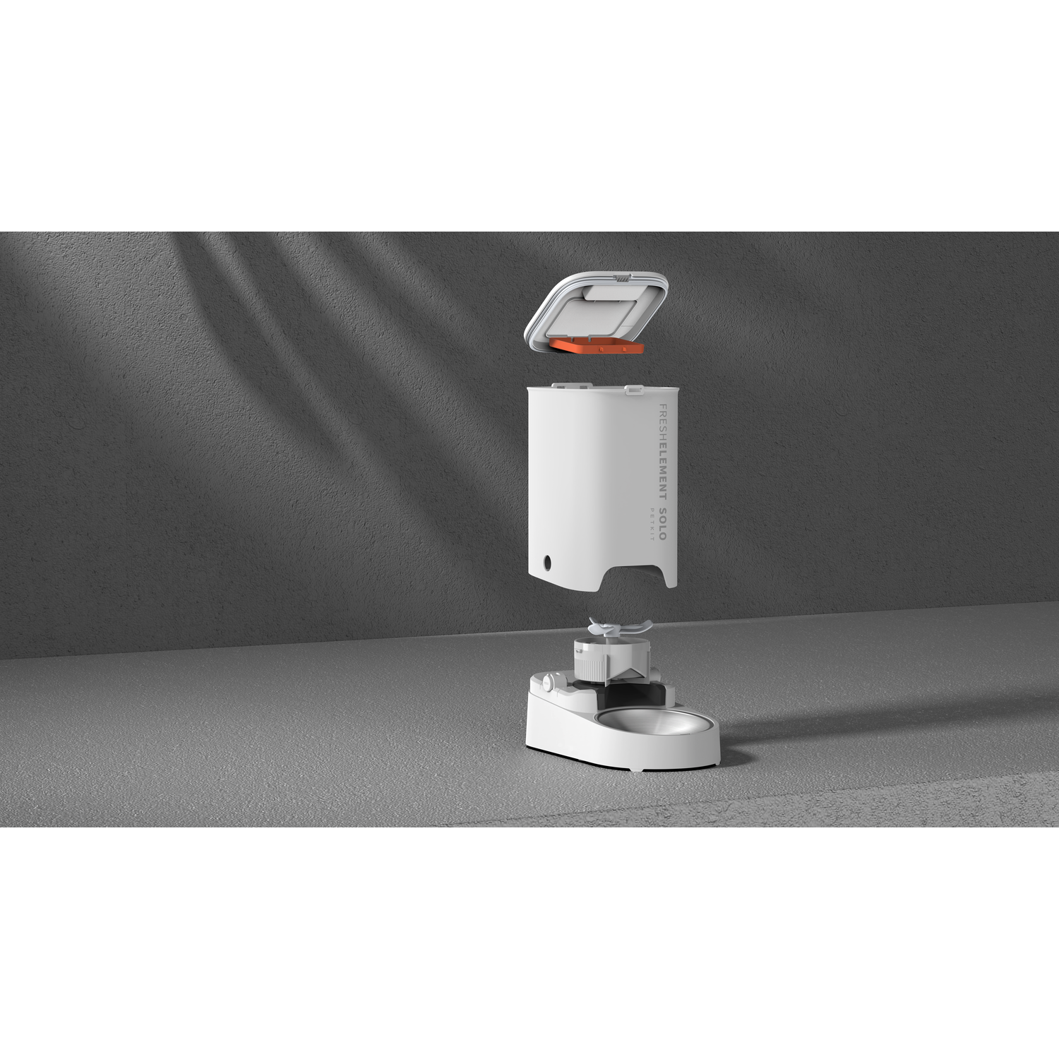 White pet food dispenser, with its lid open and its components separated. Gray background.