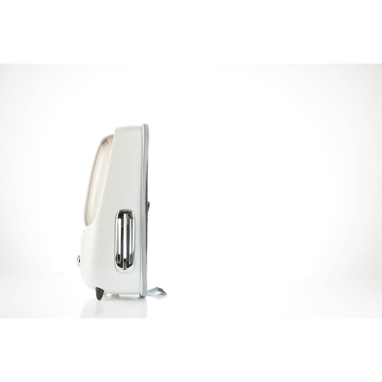 Side view of a white retro-style appliance with chrome accents, on a white surface.