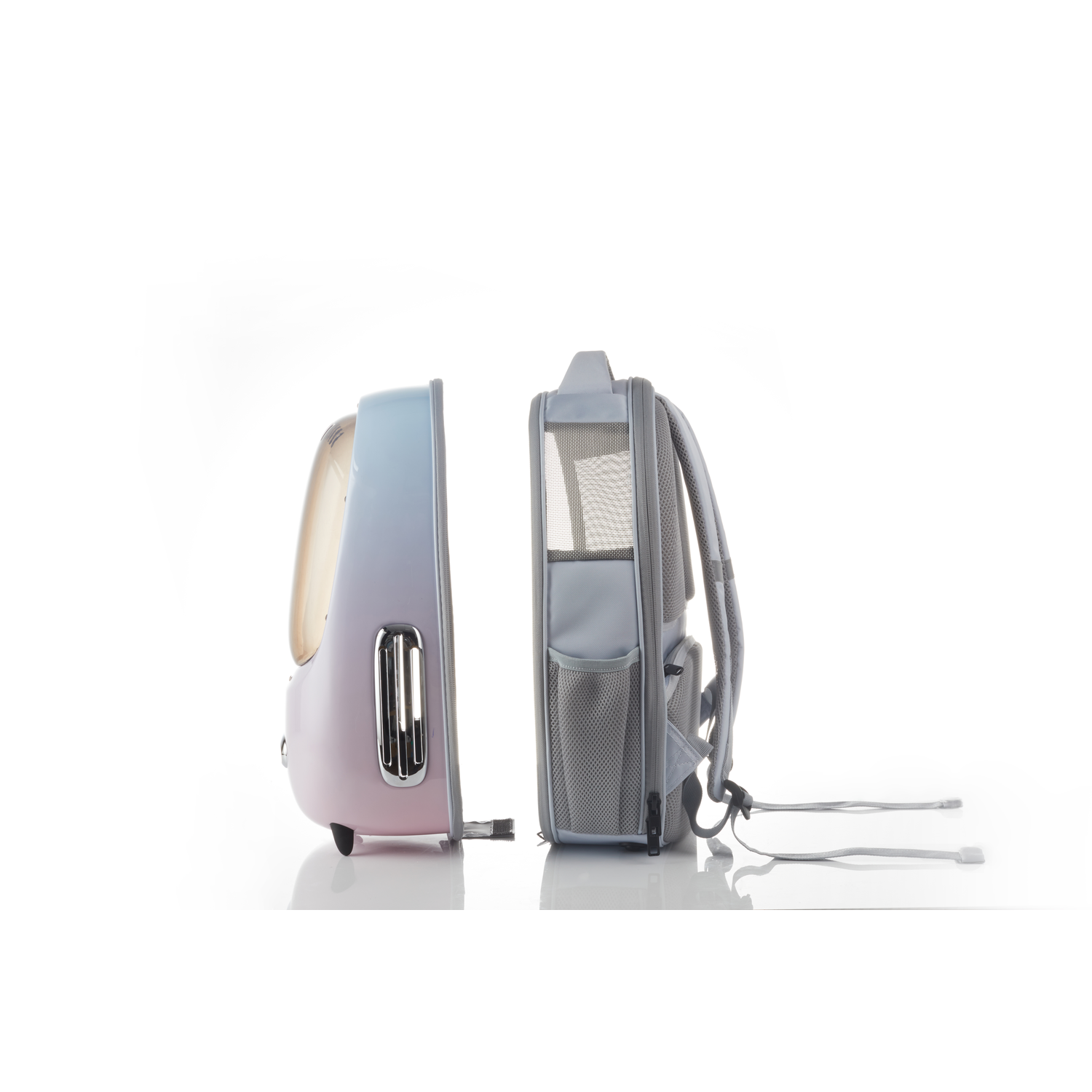 A pet carrier backpack is open. One side is pink and blue, and the other is gray.