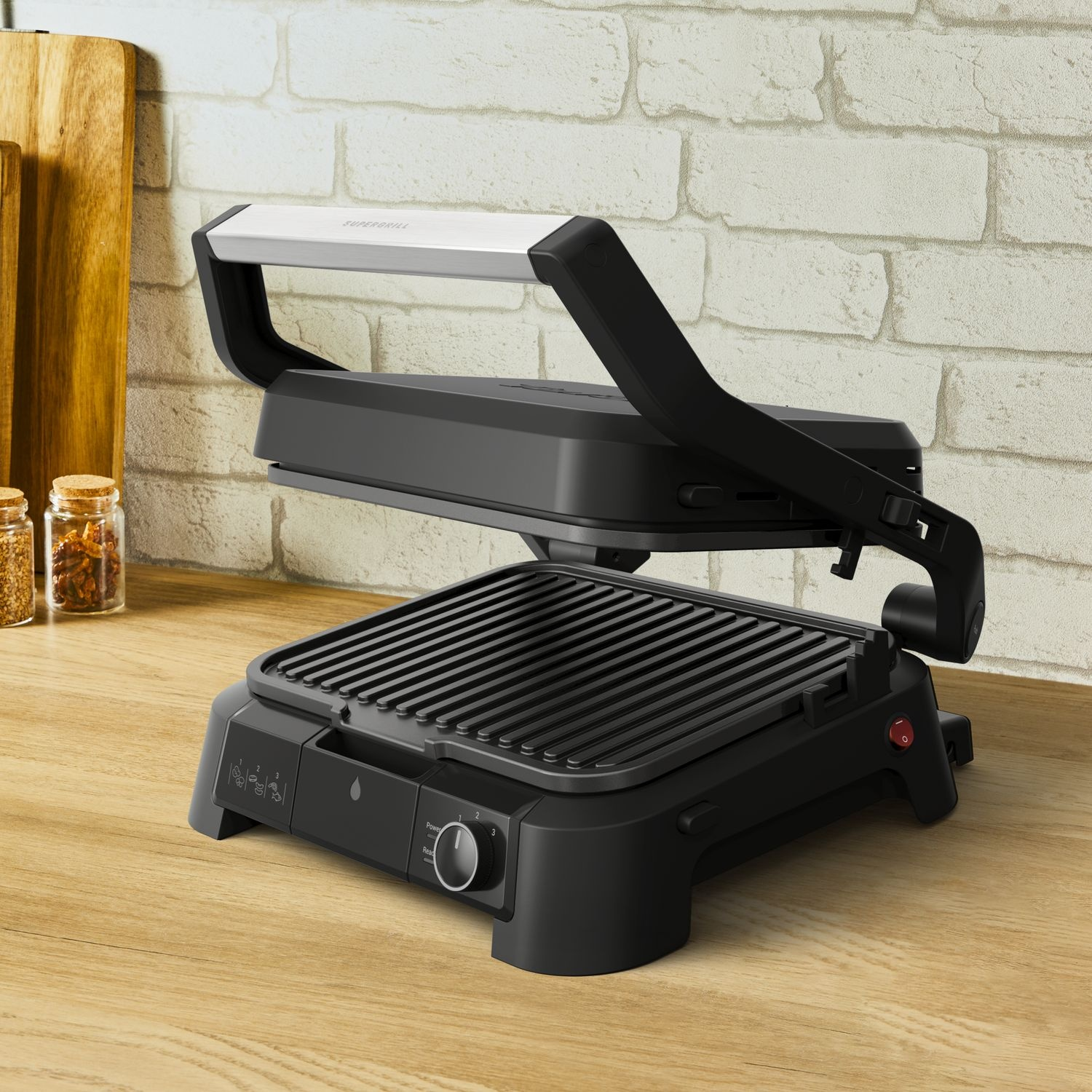 Black panini press on a wooden counter. The lid is open, showing grill grates.
