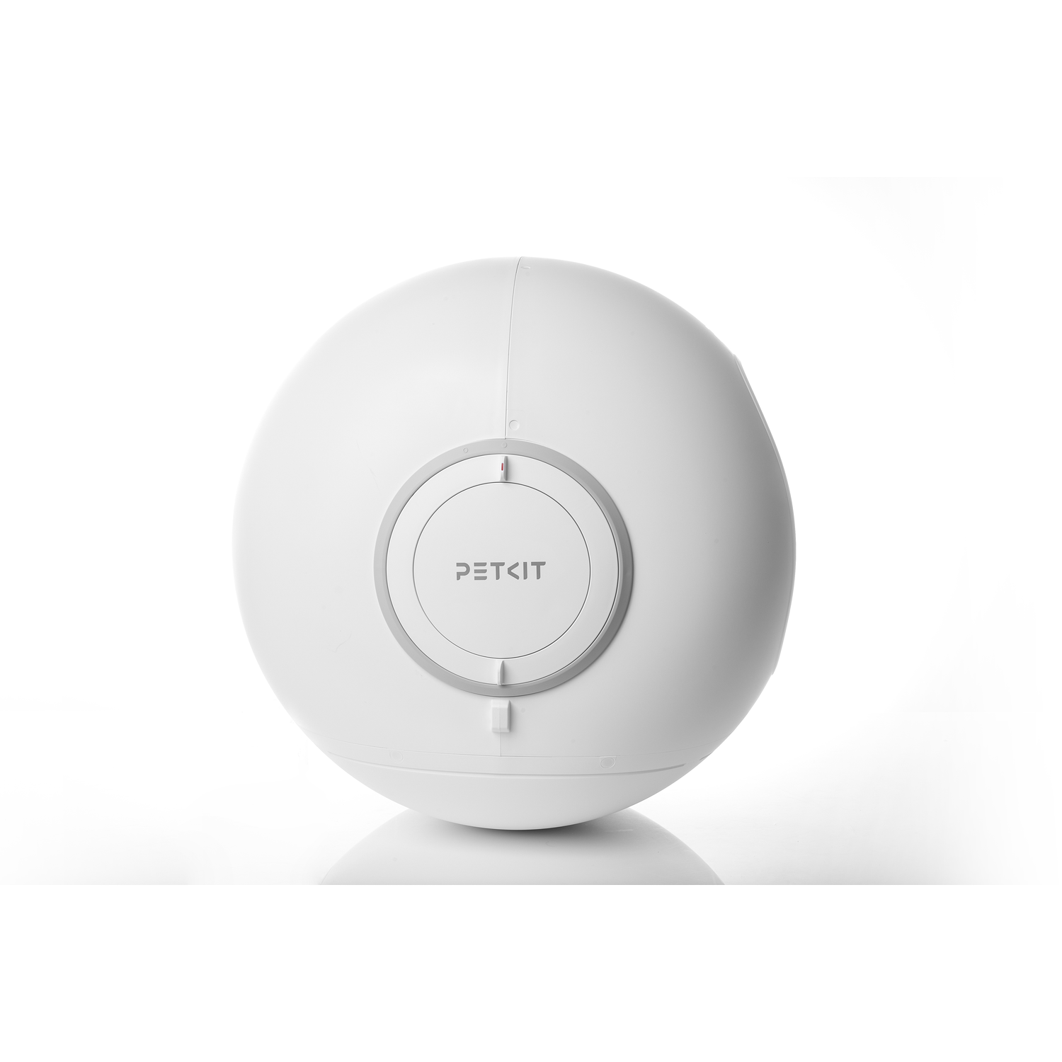 A white, spherical device with the word 'PETKIT' on its center. It sits on a white surface.