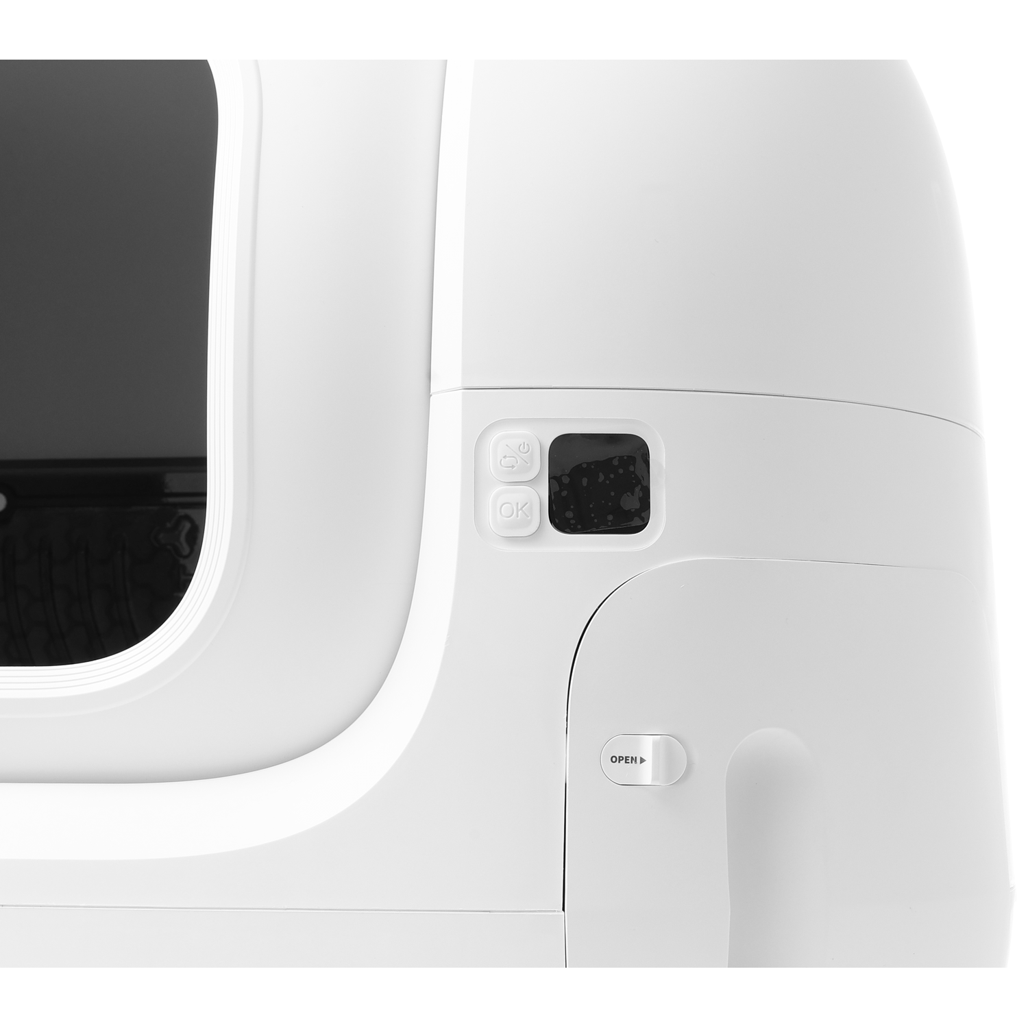 Close up of a white, curved pet litter box.  Buttons and opening are visible.