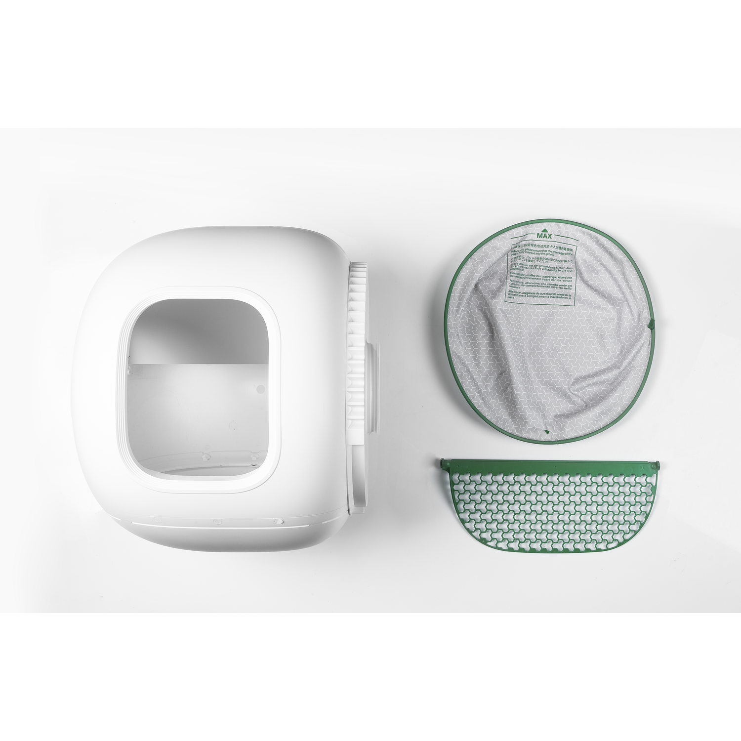 White cat litter box with accessories. Green scoop and filter. White background.