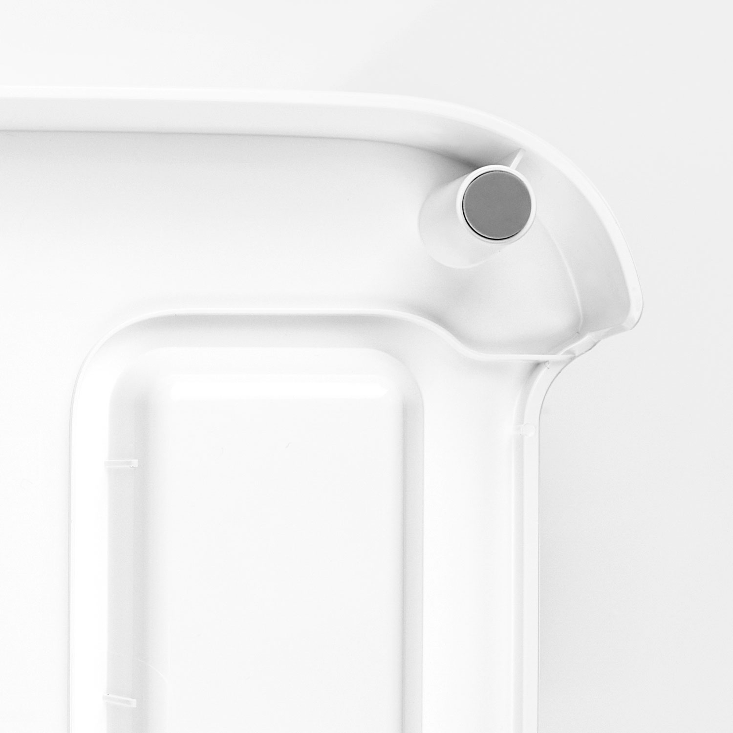 A white object corner, with a small circle, with grey dot, isolated on white.