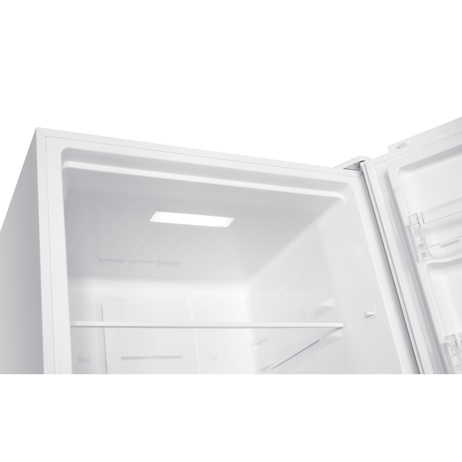 White refrigerator interior with a shelf.