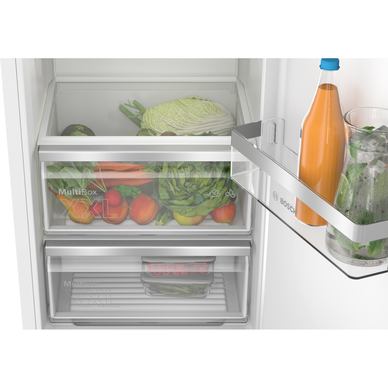 Refrigerator with vegetable drawers and a bottle of juice.