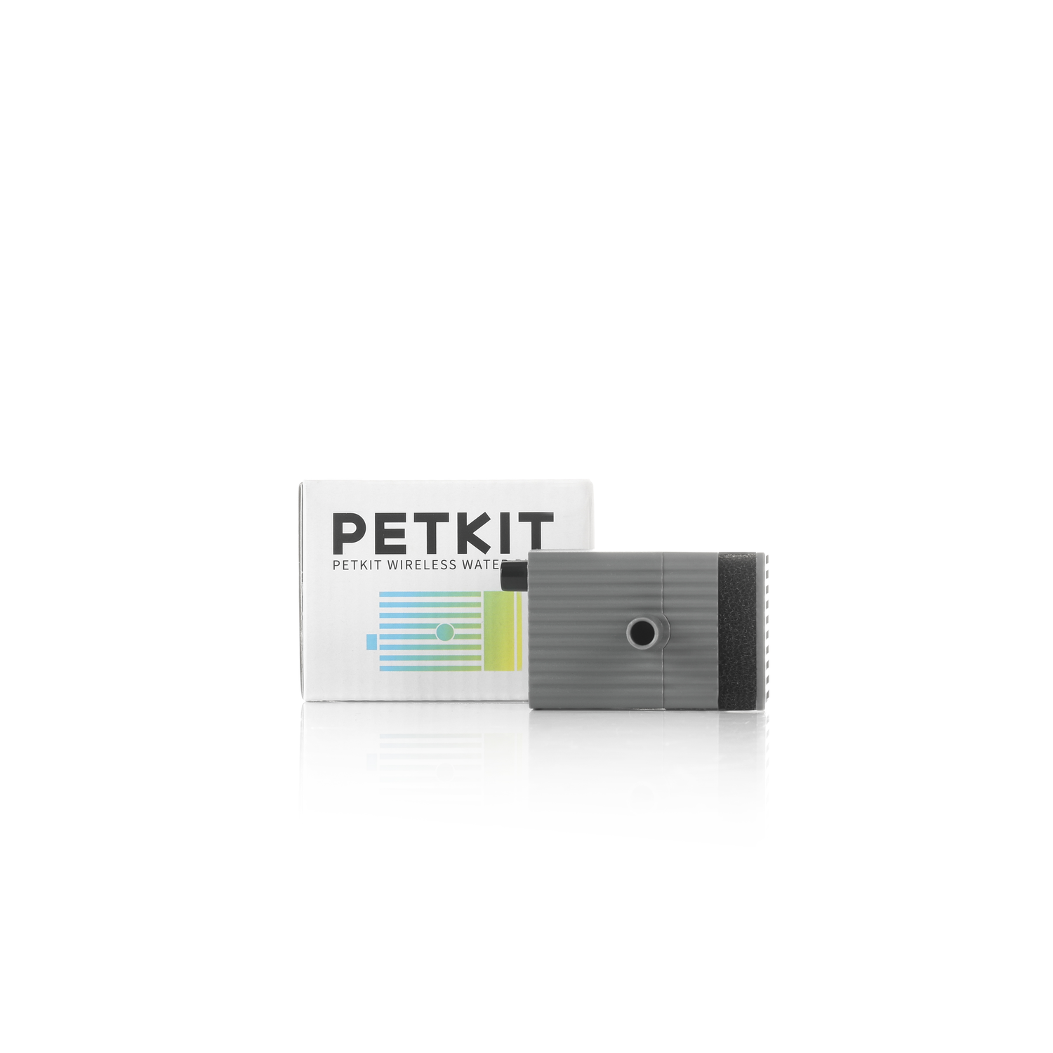 A gray PETKIT device with a box, both on a white surface. The box has text.