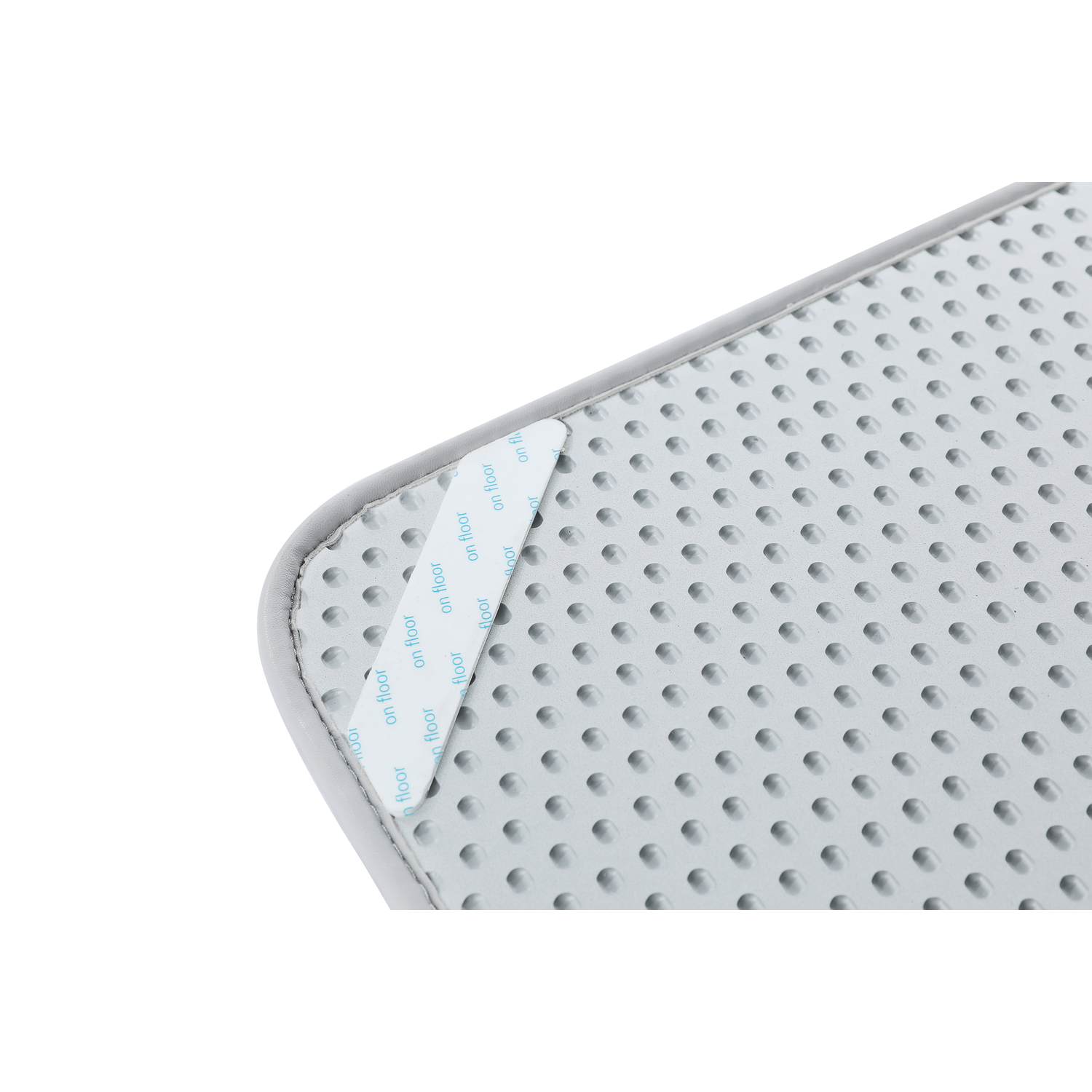 A gray, textured surface with small bumps. The corner has a blue label saying 'on floor'.
