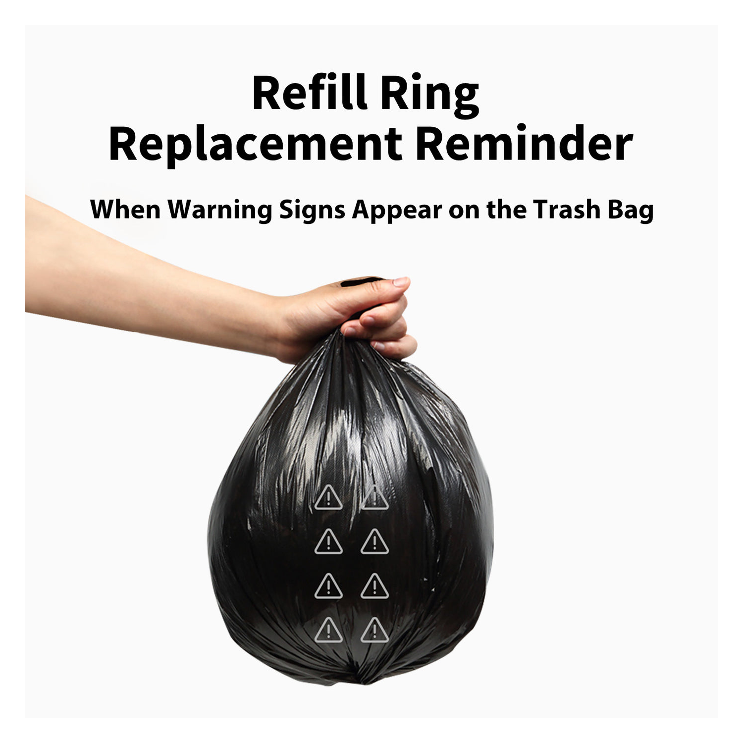 A hand holding a black trash bag with warning signs.