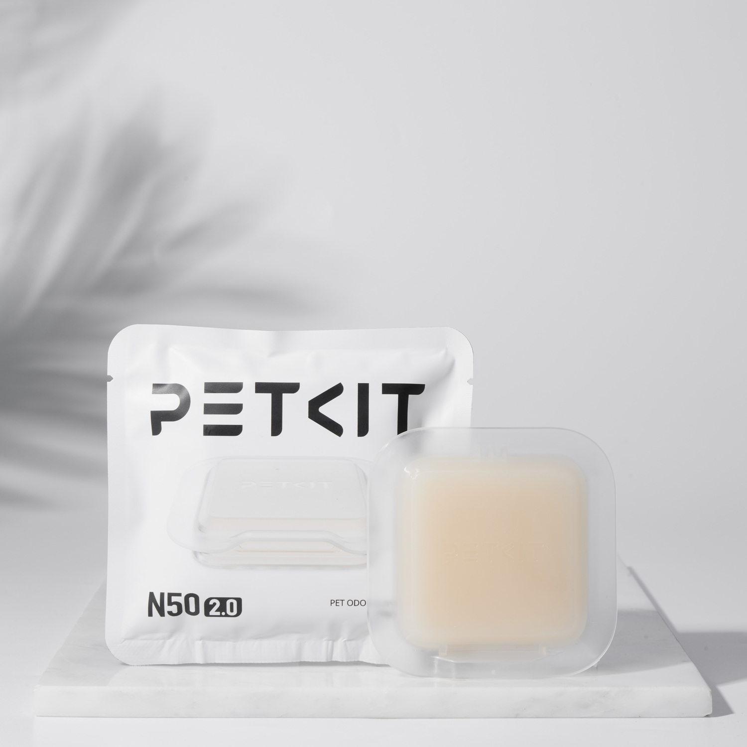 White PETKIT package with an odor eliminator, featuring a clear, gel-like substance.
