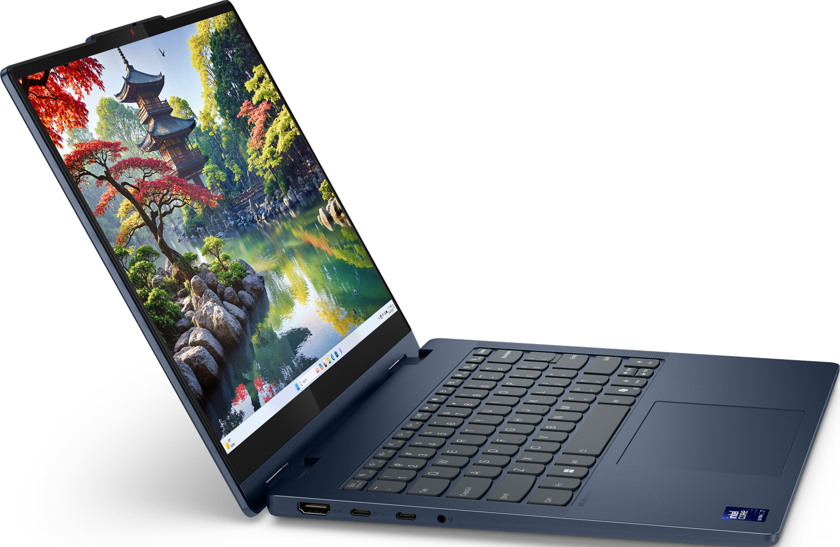 Ein blaues Laptop, das geöffnet ist und ein Landschaftsbild auf dem Bildschirm zeigt. Ein Garten ist sichtbar.