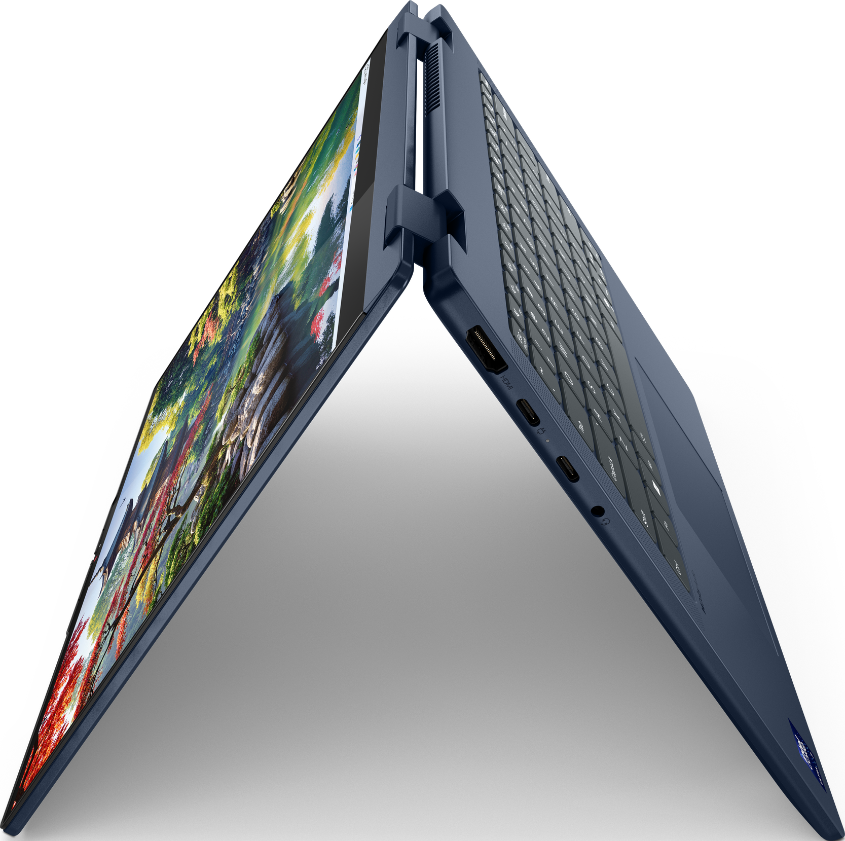 Blauer Laptop, geöffnet, zeigt eine japanische Gartenszene mit Stift.