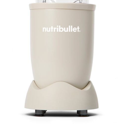 Beżowa podstawa blendera Nutribullet z nazwą marki. Ma zakrzywioną podstawę i czarne nóżki.