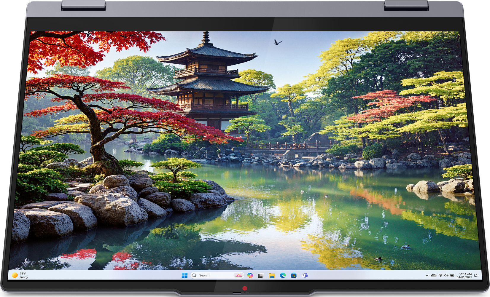 Laptop blu, parzialmente aperto, che mostra una scena di giardino giapponese.