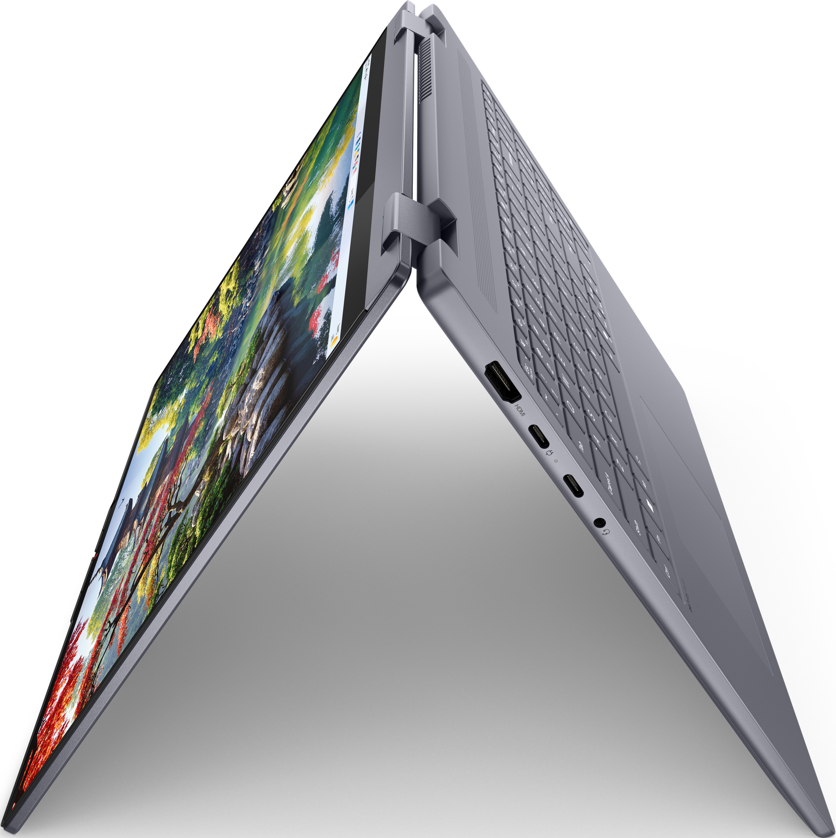 Un laptop con display aperto, che mostra un'immagine colorata, su sfondo nero.