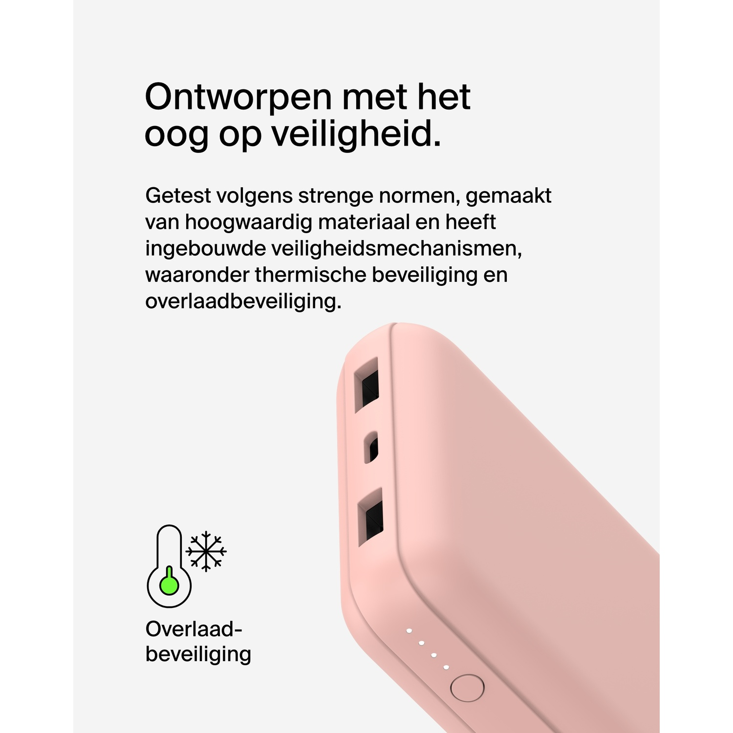 Een roze powerbank met veiligheidsinformatie en een sneeuwvlok-icoon.
