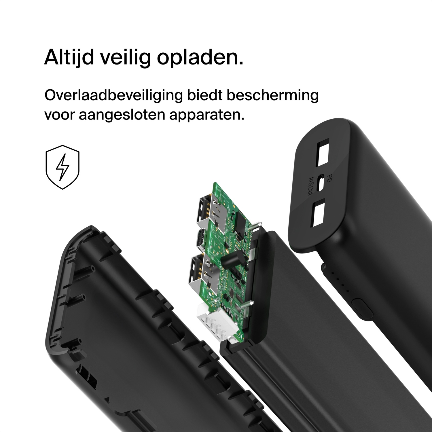 Black power bank, cut open, showing internal components. Black background.