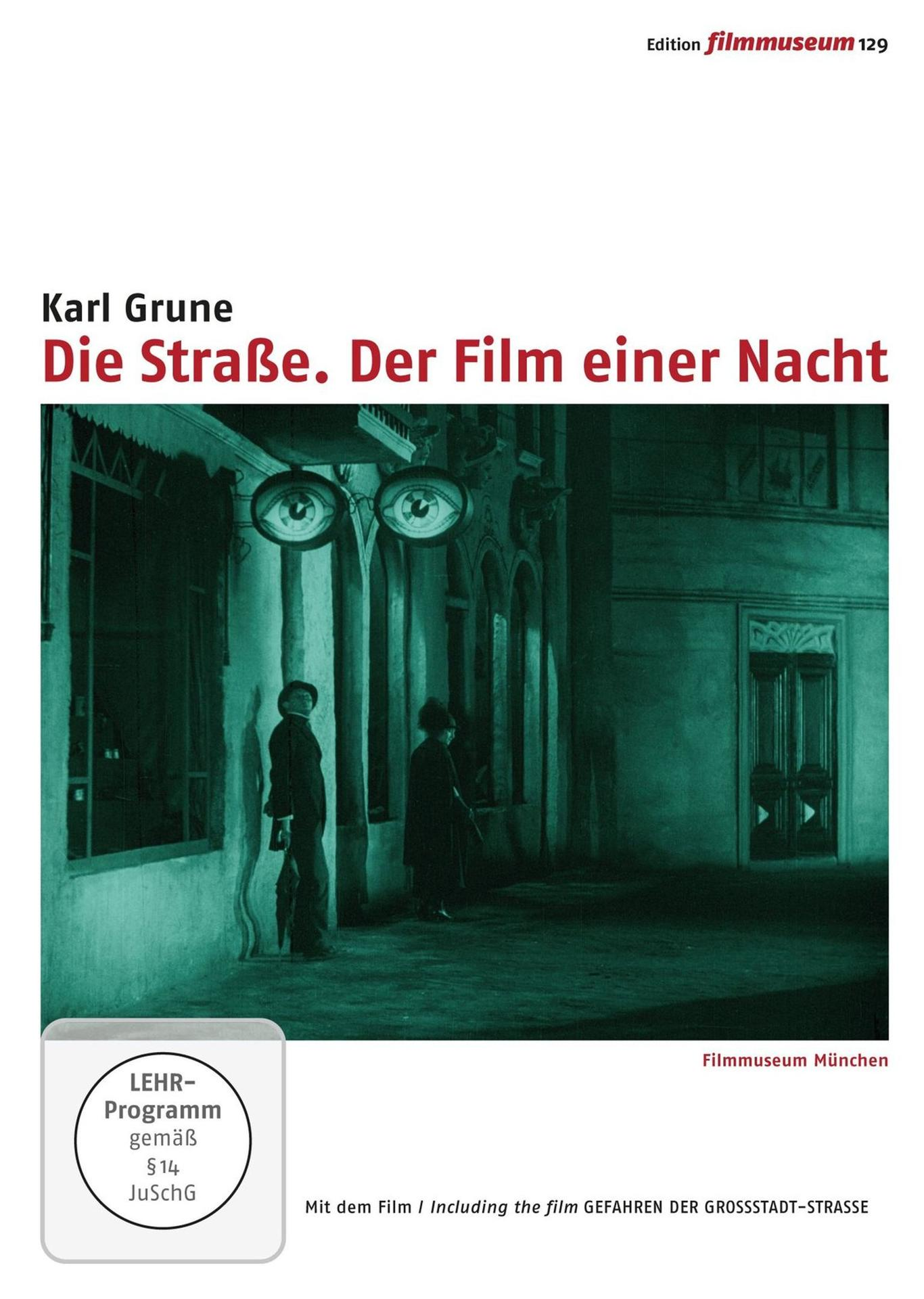 Poster für den Film Die Straße, mit einer Nachtszene mit zwei Figuren vor einem Gebäude.