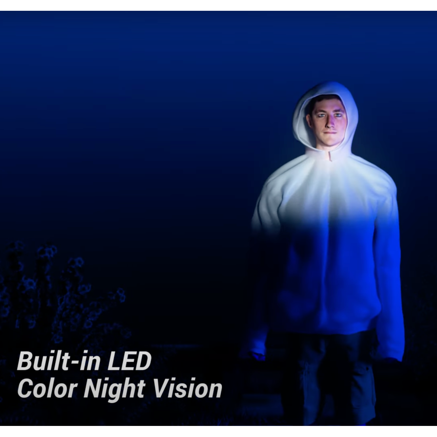 A person wearing a white hoodie illuminated by blue light, on a dark background.
