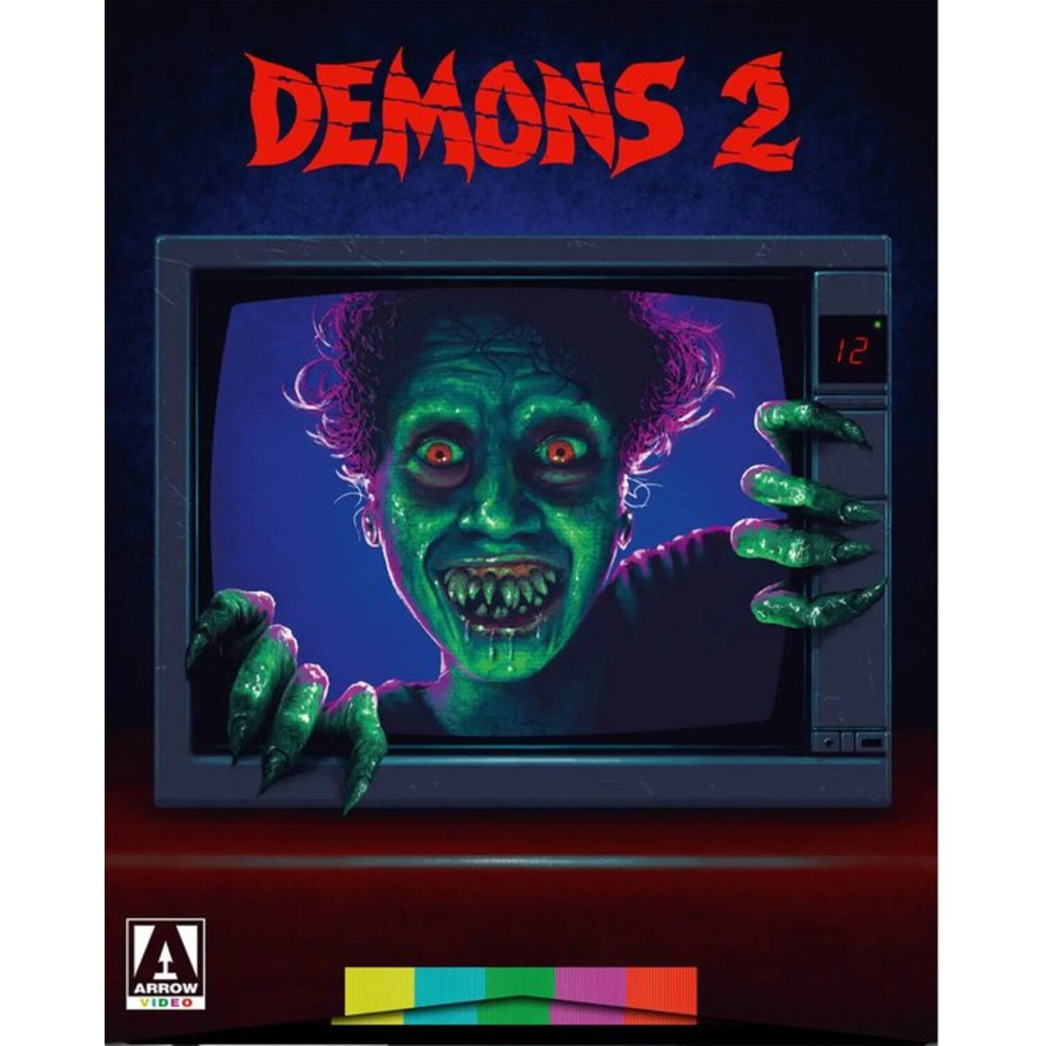 Couverture de film : zombie vert dans un écran TV, titre 'Demons 2'. Fond bleu foncé.