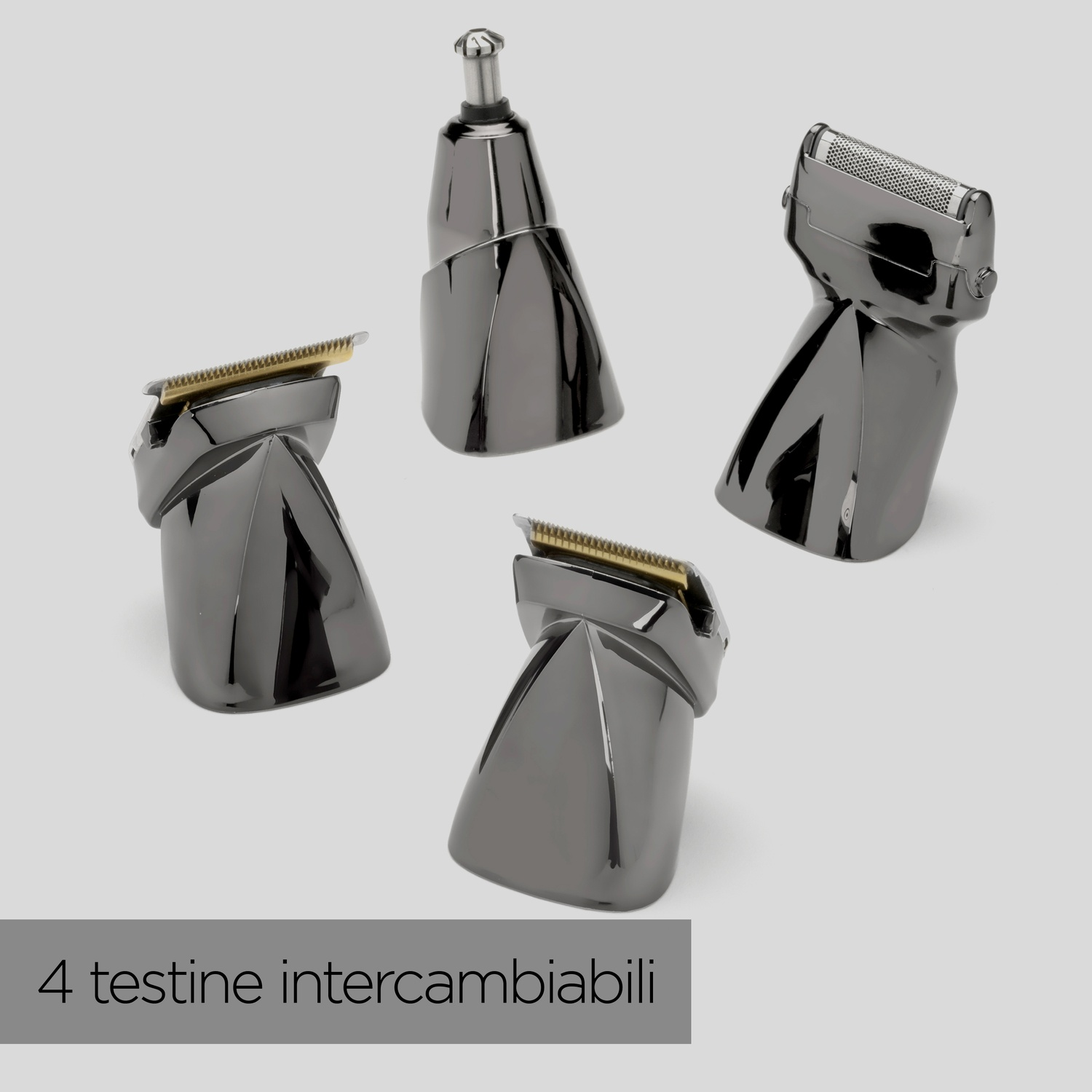 Quattro accessori per la toelettatura neri su una superficie grigio chiaro. Testo in basso: 4 testine intercambiabili.