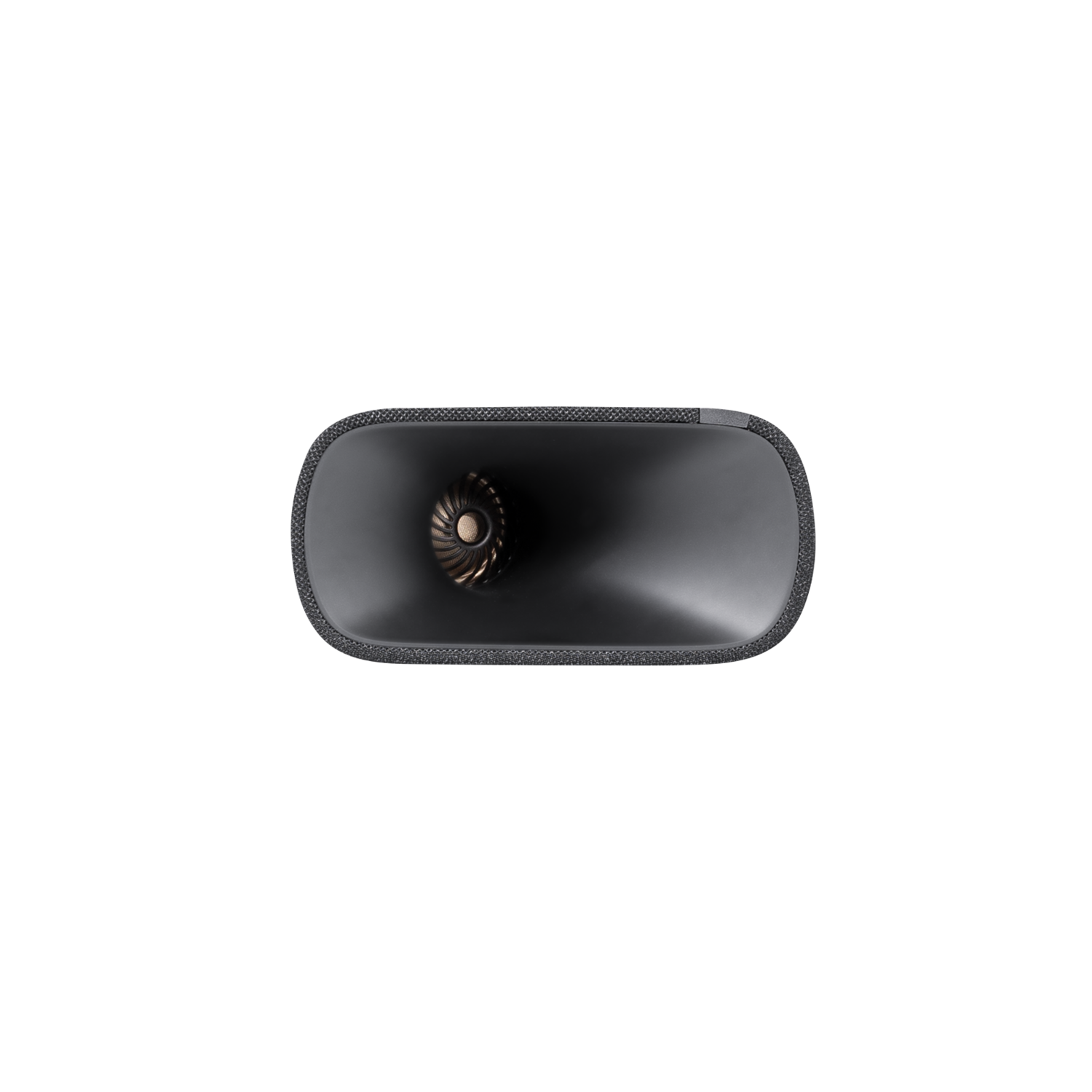 Overhead view of a black speaker on a black surface.