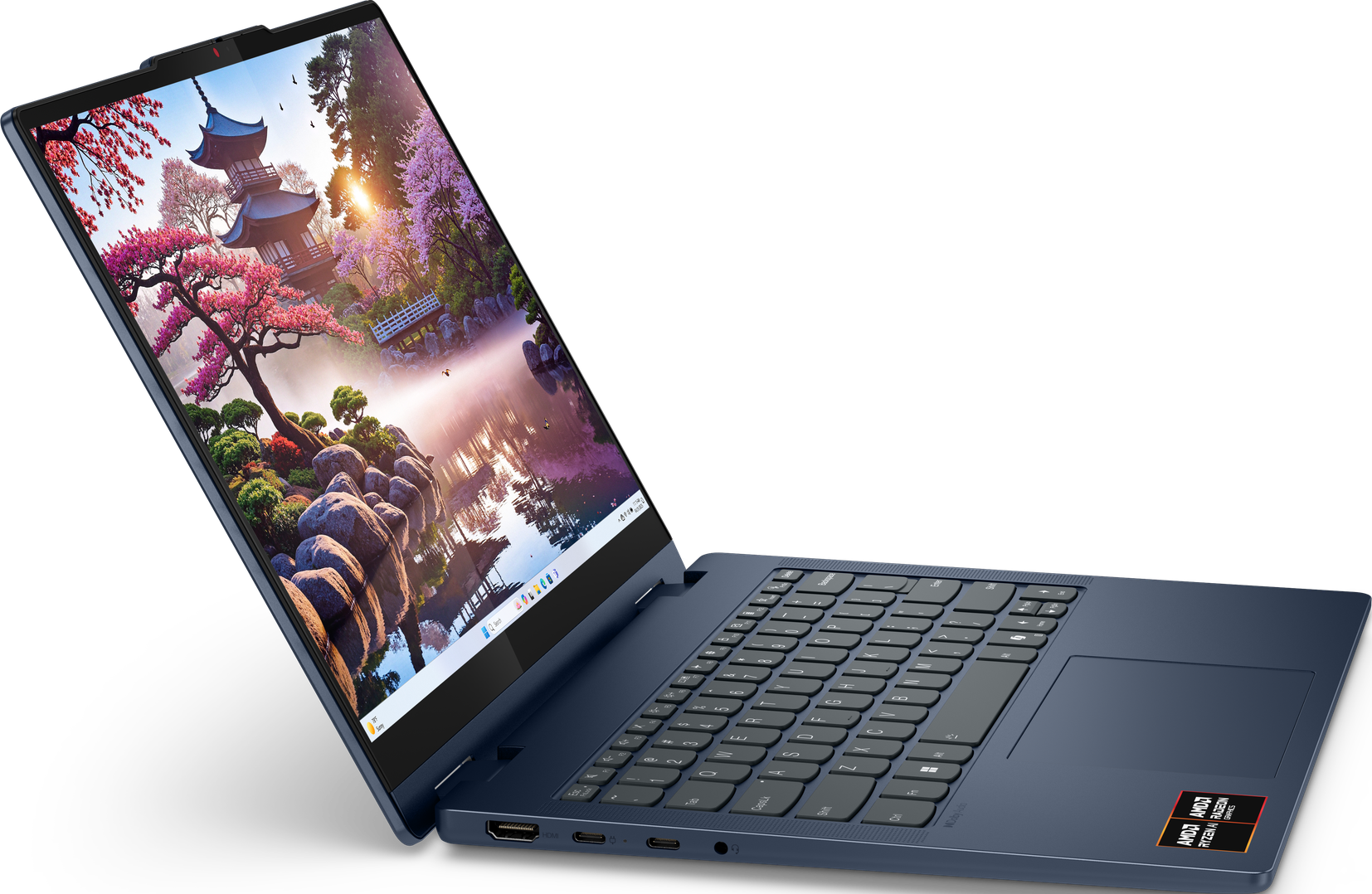 Ein Laptop mit einer japanischen Szene mit See, Bäumen und Tempel. Auf dunkler blauer Oberfläche geöffnet.