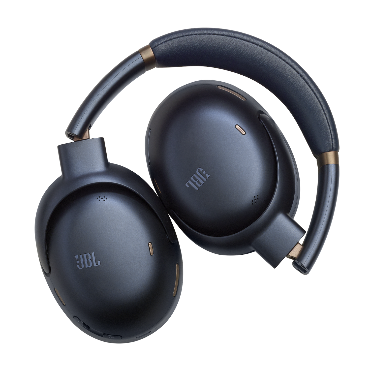 Les écouteurs JBL noirs sont pliés. Des accents dorés sont visibles.