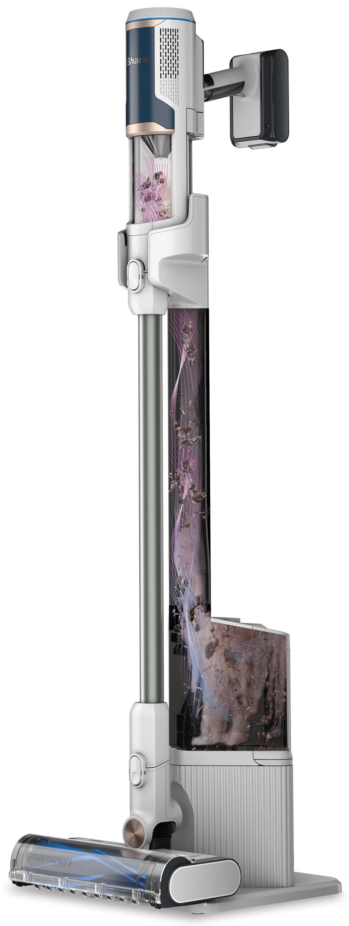 Biały i niebieski odkurzacz stoi na białej podstawie.