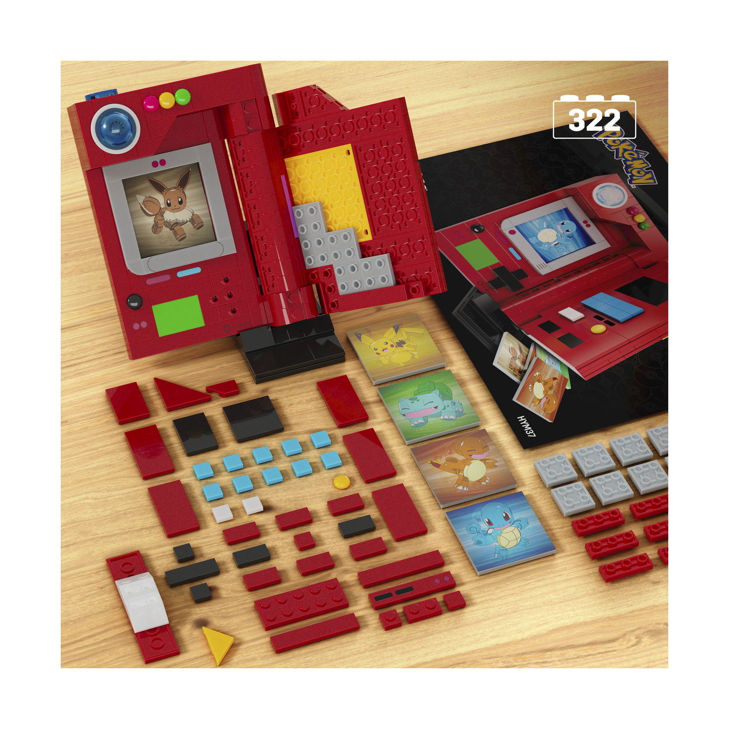 Set di costruzione Pokémon con blocchi, immagine di Eevee e carte su una superficie di legno.