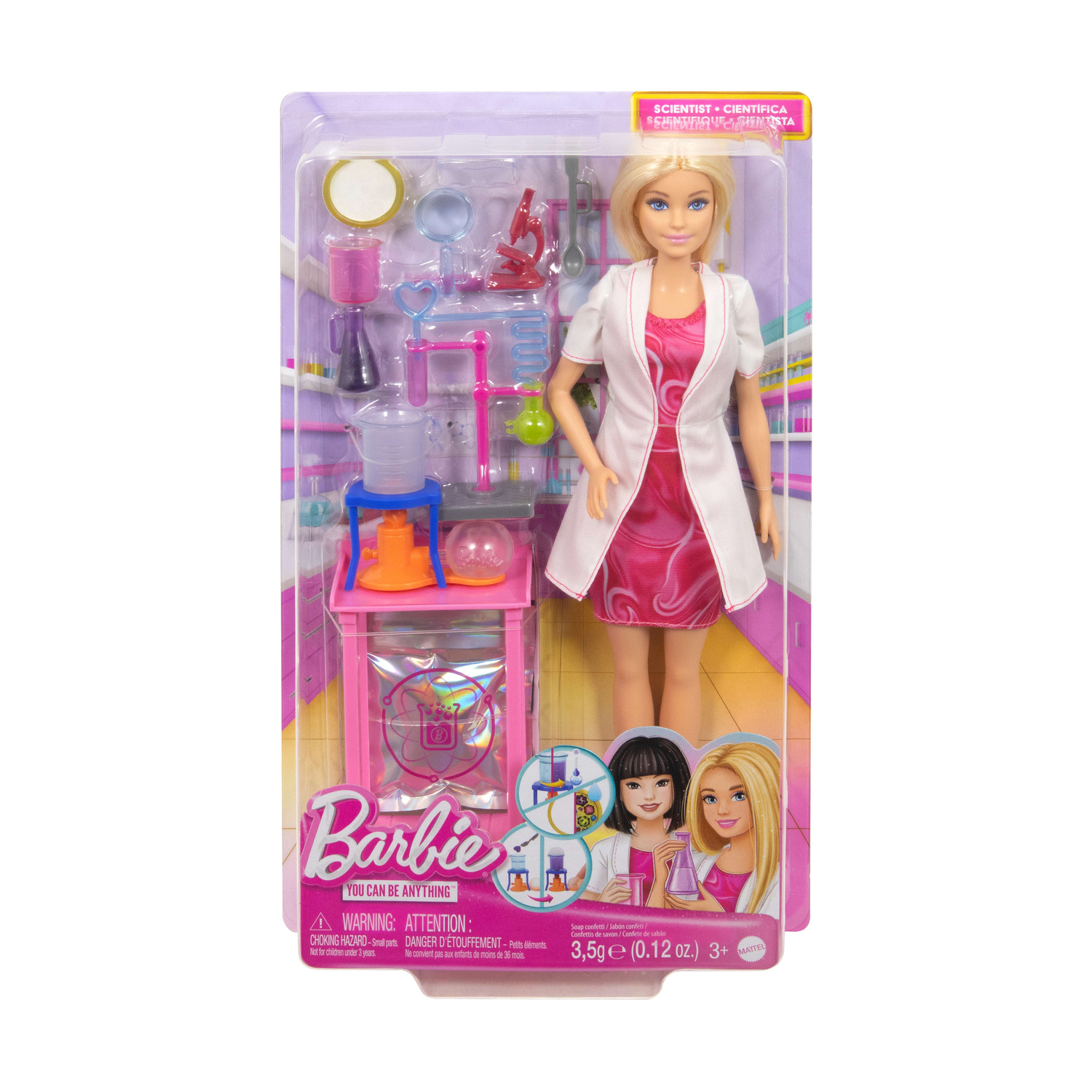 Bambola Barbie con camice da laboratorio, abito rosa, di fronte a attrezzature da laboratorio in una confezione.