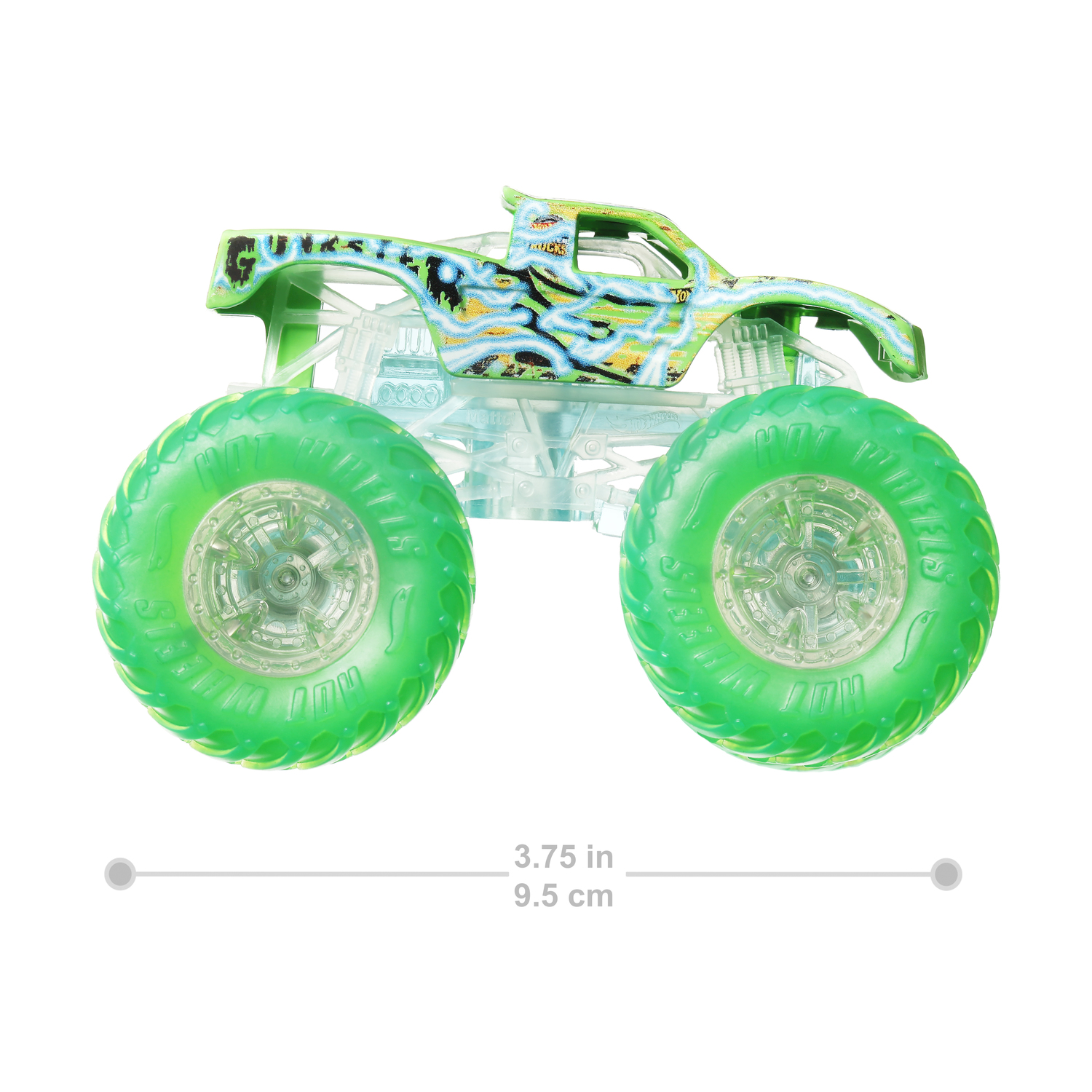 Monster truck verde con ruote grandi, con una scala di misurazione sotto.