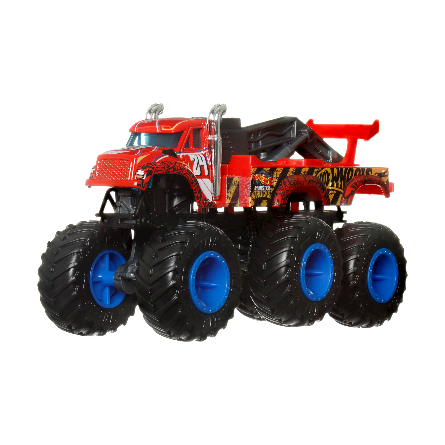 Giocattolo monster truck rosso e nero. Ha pneumatici grandi e un gancio di traino sul retro.
