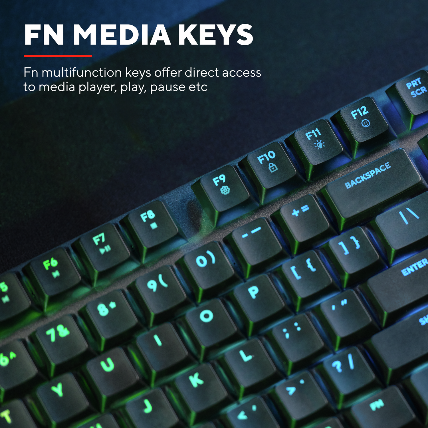 Close-up of a black keyboard with green illuminated keys. Text: Fn media keys, Fn keys offer direct access to media player.