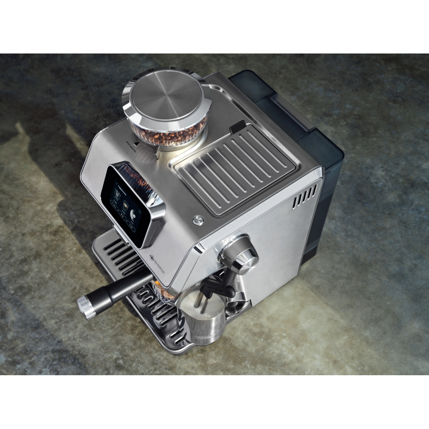 Silver coffee machine with a bean container and a display, top view.