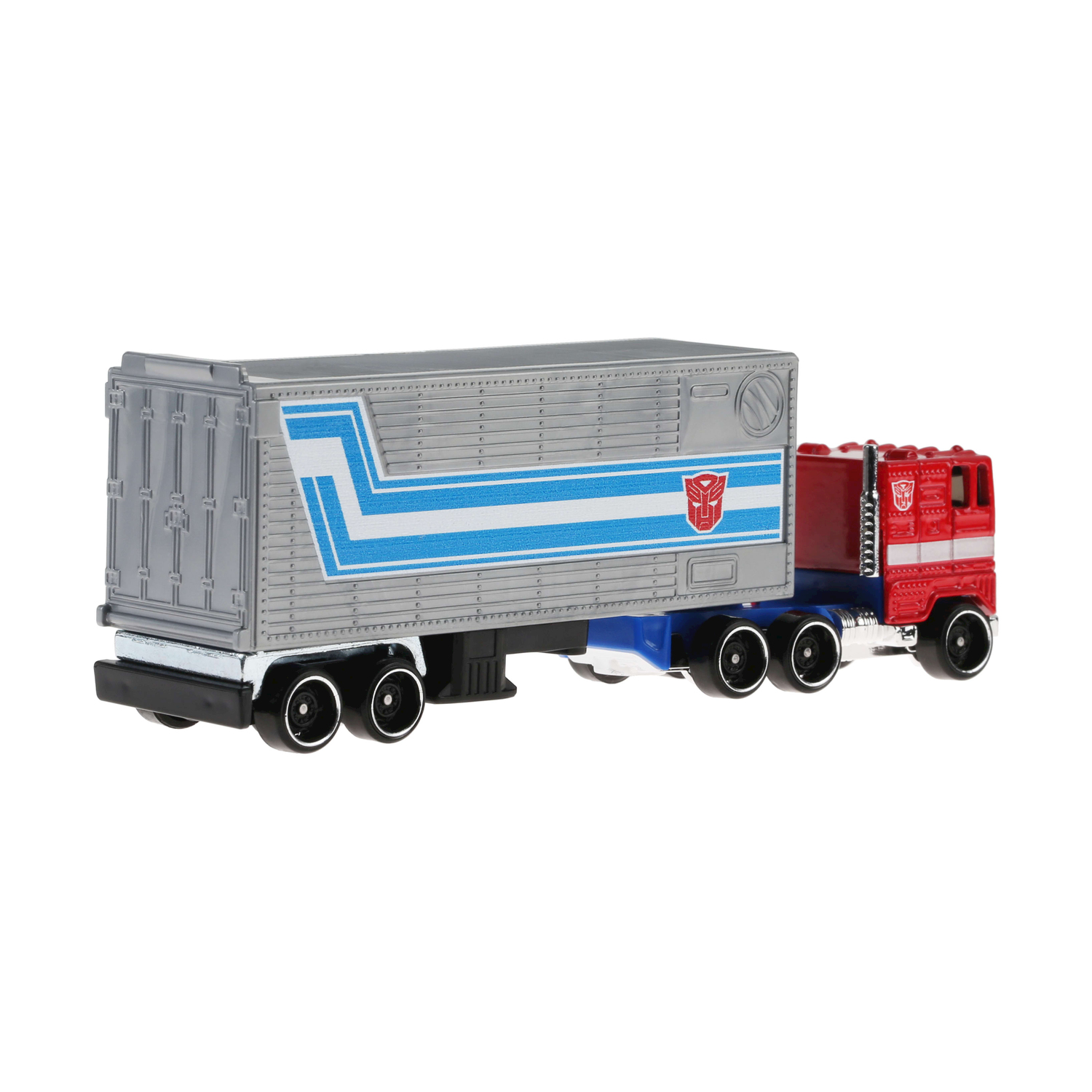 Un giocattolo di camion Optimus Prime rosso e blu con un rimorchio grigio su sfondo bianco.