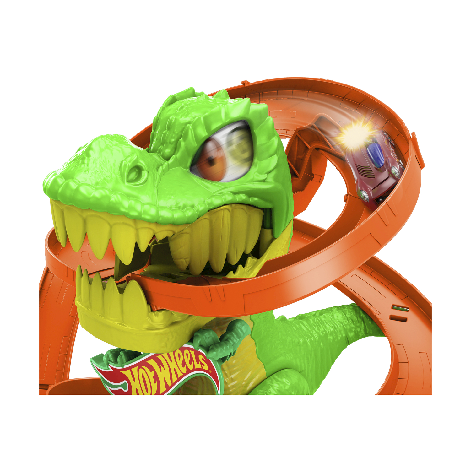 Pista di dinosauri Hot Wheels con un'auto. L'auto corre sulla pista arancione.