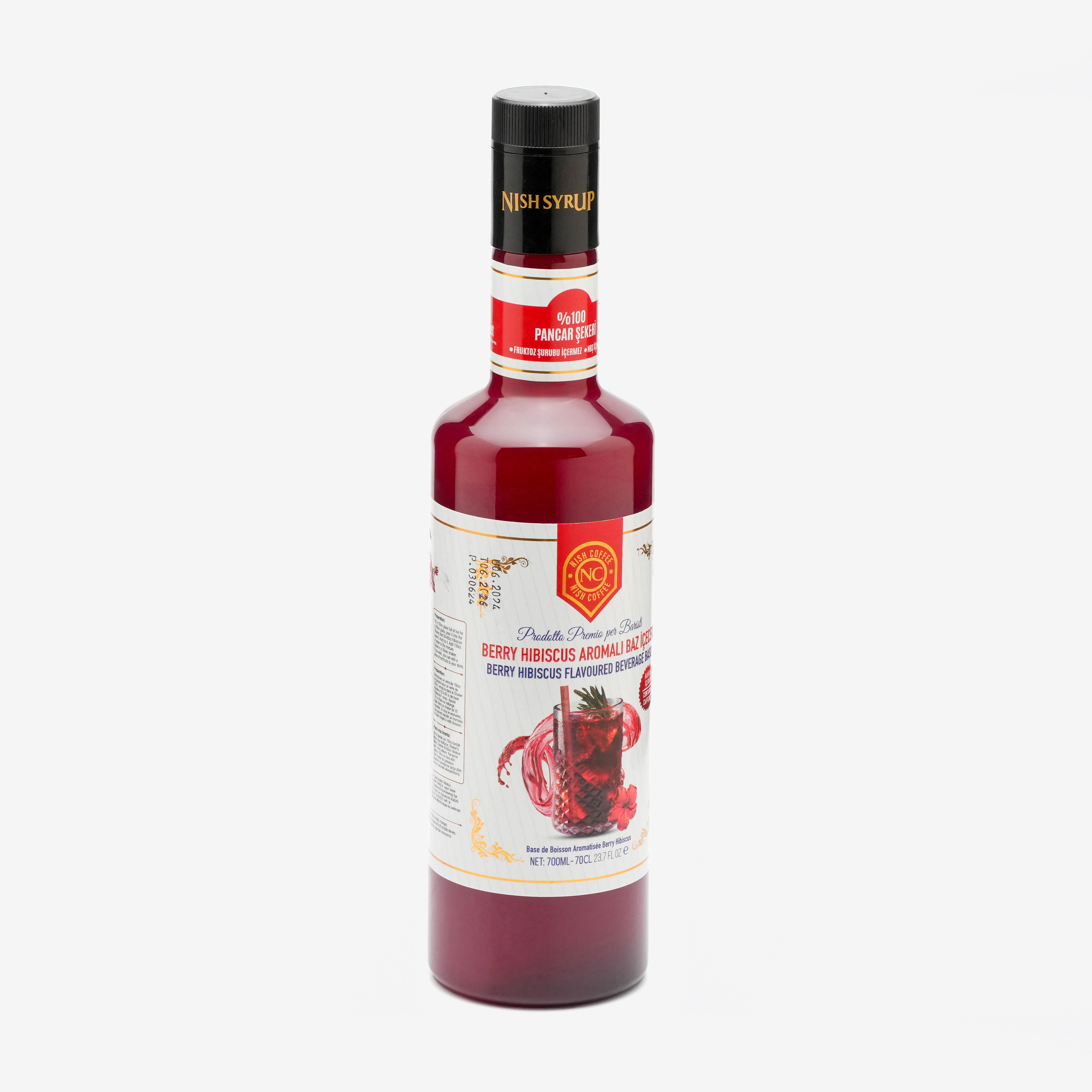 Nish Şurubu şişesi, Berry Hibiscus aromalı. Etikette berry resmi ve metin gösteriliyor. Beyaz zemin.