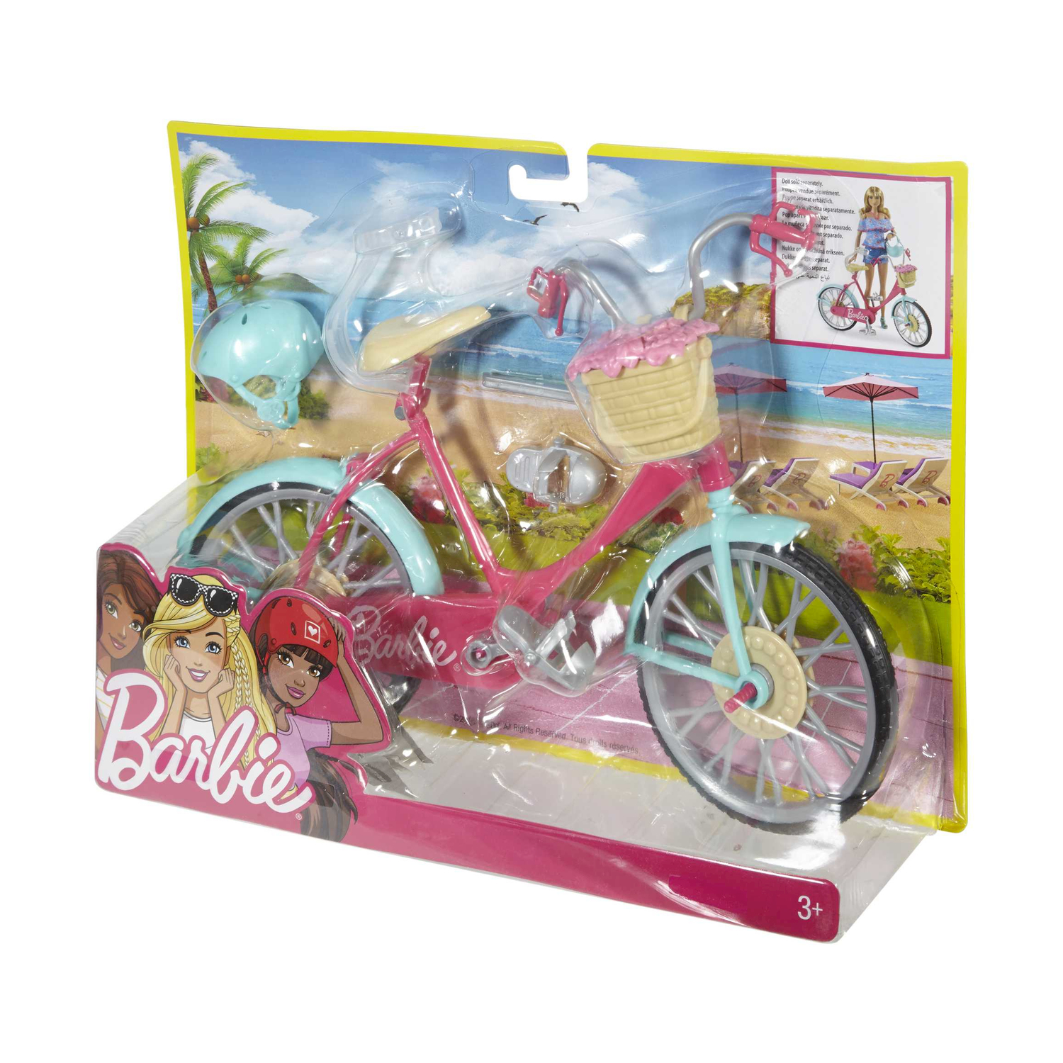 Un giocattolo di bicicletta Barbie nella confezione. La bici è rosa e blu. L'arte della scatola mostra le bambole Barbie.