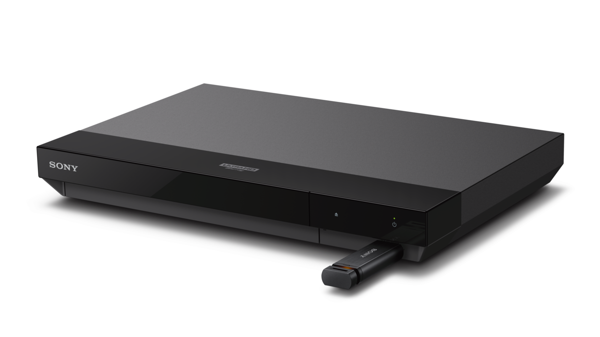 Reproductor de DVD negro con una memoria USB insertada, vista en ángulo sobre una superficie blanca, marca Sony visible.