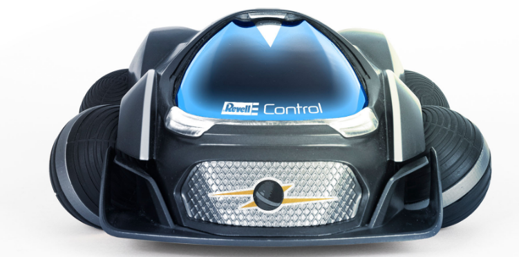 Ein futuristisches Spielzeugauto in Schwarz und Silber mit einer durchsichtigen Frontscheibe auf weißem Hintergrund.